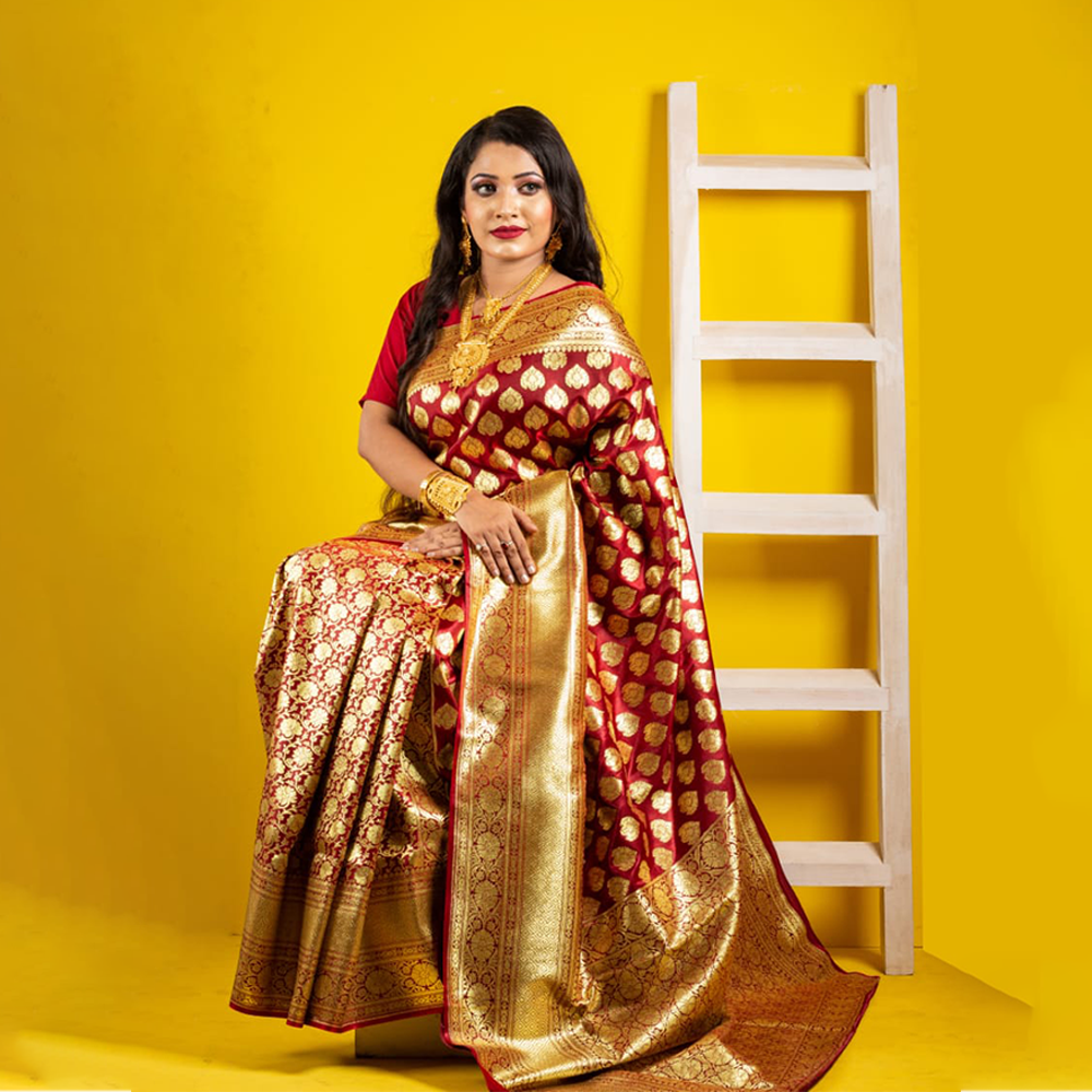 Maroon banarasi silk saree with golden belt